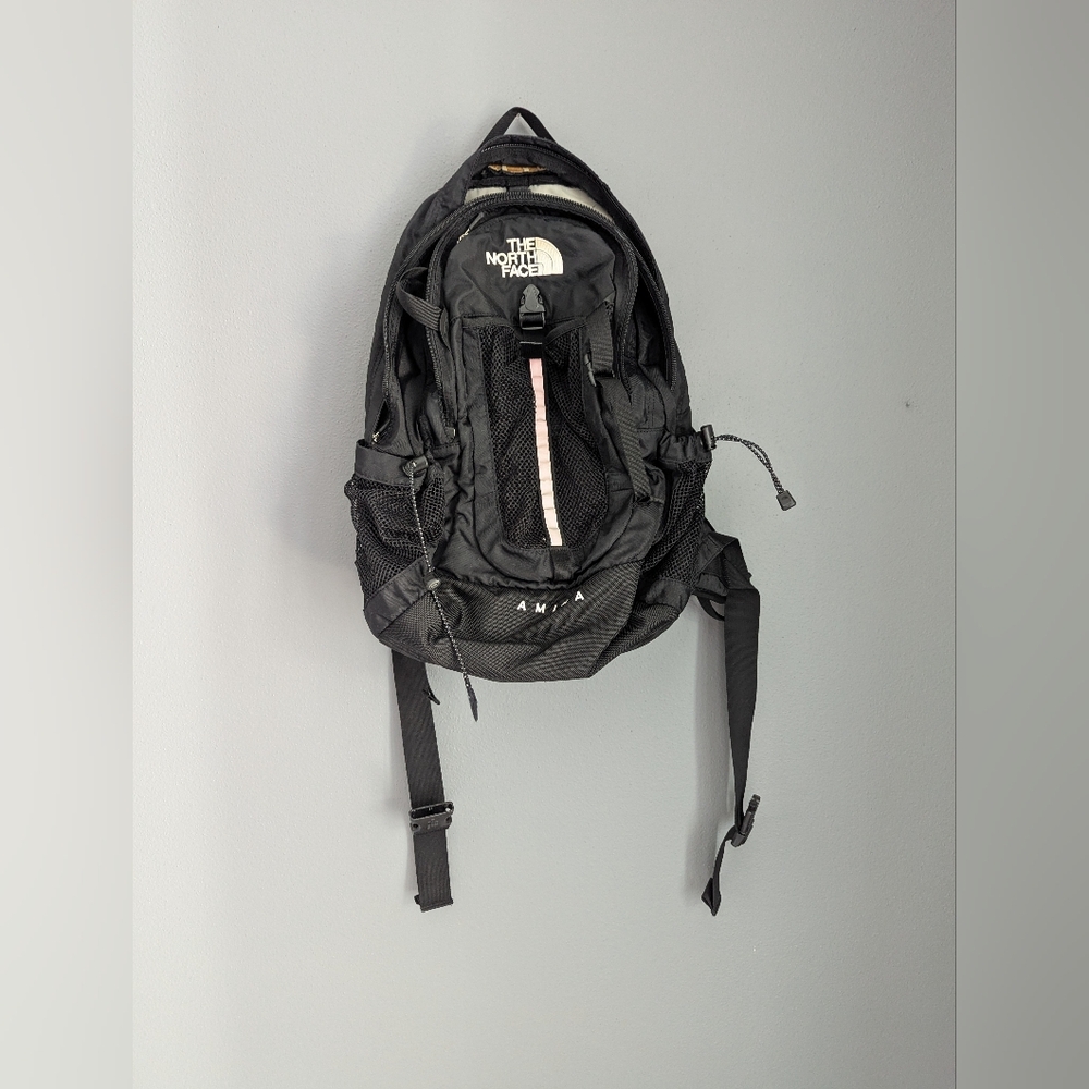 The North Face Black Amira Backpack With Adjustable Chest And Waist Straps.
